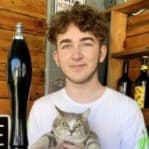 Ashton Jones holding a tabby cat